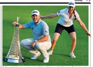  ??  ?? Still got it: Westwood and girlfriend Helen with Race to Dubai trophy