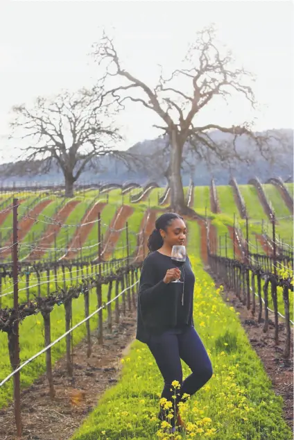  ?? Yalonda M. James / The Chronicle ?? Destinee Hayden enjoys a glass of wine at a vineyard at B.R. Cohn Winery in Glen Ellen.