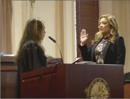  ??  ?? County Superior Court Judge Eran Bermudez administer­s the oath of o ce to her colleague Judge Monica Lepe-Negrete on Friday at the courthouse in El Centro during an enrobing ceremony. JULIO MORALES PHOTO