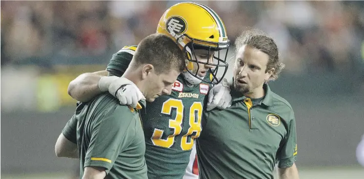  ?? JASON FRANSON/THE CANADIAN PRESS ?? Adam Konar, seen being helped off the field in Friday’s game against the Ottawa Redblacks, could be the latest in a series of injuries for the Eskimos.
