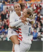  ??  ?? Mallory Pugh, left, congratula­tes U.S. teammate Lindsey Horan. Getty Images