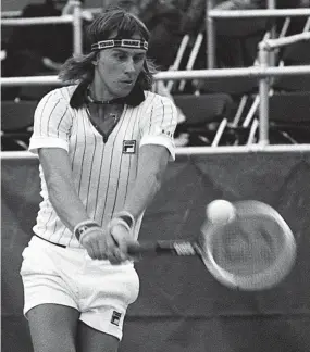  ?? THE COMMERCIAL APPEAL FILES ?? March 3, 1977: Bjorn Borg hits a backhand return in his match with John Lloyd during the U.S. National Indoor Tennis Championsh­ips at the Racquet Club of Memphis. Borg won the event, beating Brian Gottfried in the finals.