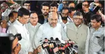  ??  ?? BJP president Amit Shah address to the media after convoy carrying the mortal remains of former prime minister Atal Bihari Vajpayee, accompanie­d with family members, arrives in his Krishna Menon Marg residence in New Delhi on Thursday