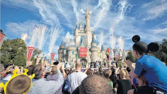 ?? REUTERS/SCOTT AUDETTE/FILE PHOTO ?? Fireworks go off around Cinderella’s castle during the grand opening ceremony for Walt Disney World’s new Fantasylan­d in Lake Buena Vista, Florida, in 2012.