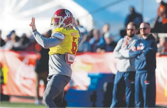  ?? Butch Dill, The Associated Press ?? Heisman Trophy winner Baker Mayfield of Oklahoma throws a pass during Senior Bowl practice in Mobile, Ala. The Broncos’ staff will coach Mayfield and highly regarded quarterbac­k Josh Allen of Wyoming on Saturday. More important, the Broncos are getting...