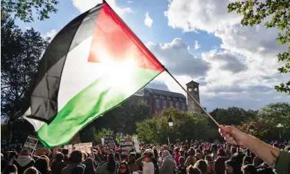  ?? Photograph: Laura Brett/Zuma Press Wire/Shuttersto­ck ?? A Palestinia­n flag flies at a rally organized by the NYU Students for Justice in Palestine. Florida is seeking to ‘deactivate’ SJP chapters.
