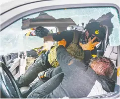  ?? NATHAN HOWARD / GETTY IMAGES ?? A member of the far-right Proud Boys and a left-wing counter-protester fight in a truck in Portland, Ore., on
Sunday, the anniversar­y of a similar fight in 2020.