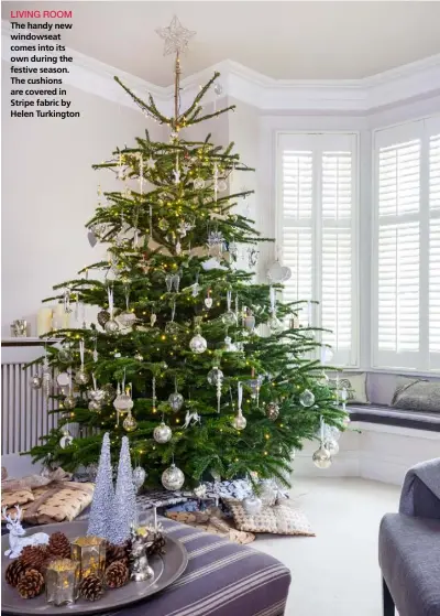  ??  ?? LIVING ROOM
The handy new windowseat comes into its own during the festive season. The cushions are covered in Stripe fabric by Helen Turkington