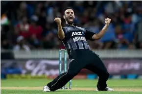  ?? GETTY IMAGES ?? Black Cap Daryl Mitchell celebrates the wicket of MS Dhoni during February’s T20 match against India at Seddon Park in Hamilton.