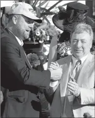  ?? AP/ MARK HUMPHREY ?? Trainer Doug O’Neill ( left), who has won the Kentucky Derby twice, started with 50 horses and is down to Irap as his lone Kentucky Derby entrant. At the beginning of the season, 418 horses were nominated for the Kentucky Derby with 20 getting into the...