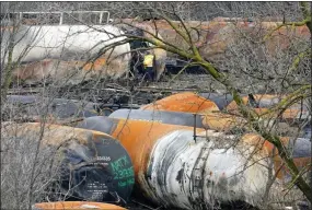  ?? GENE J. PUSKAR — THE ASSOCIATED PRESS ?? The cleanup of portions of a Norfolk Southern freight train that derailed Friday night in East Palestine, Ohio, continues on Thursday, Feb. 9, 2023.