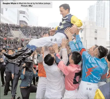  ?? Picture: HKJ ?? Douglas Whyte is lifted into the air by his fellow jockeys.