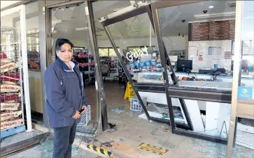  ??  ?? Shattered: United service station employee Esther Bethune said this was the third time the service station had been targeted this year.