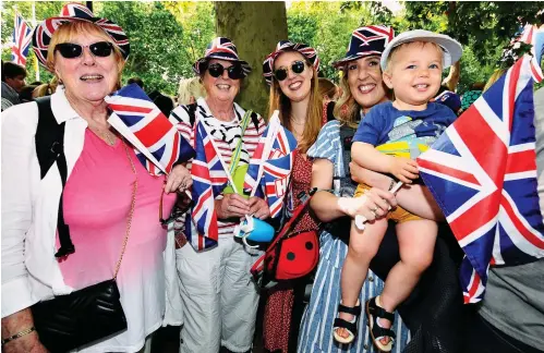  ?? ?? Patriotic party: Three generation­s – Alison, Judie, Charlotte, Catherine and 18-month-old James – on The Mall yesterday