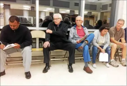  ?? EVAN BRANDT — DIGITAL FIRST MEDIA ?? Upper Pottsgrove residents line up to speak at a special hearing Monday night about the proposal to spend about $2million on a new seven-bay, 12,000 square-foot solar-powered highway garage on the township’s property on Heather Place.