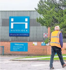  ?? Picture: Steve MacDougall. ?? A worker leaves Havelock last month after being told the company was entering administra­tion.