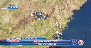  ?? WSVN/COURTESY ?? Authoritie­s search last September for a baby who is missing from a car that veered off the road and flipped over in a grassy area on Alligator Alley west of Broward County.
