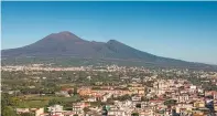  ?? SUSAN WRIGHT/NEW YORK TIMES FILE PHOTO ?? Mount Vesuvius looms over Pompeii, Italy, in 2019. Archaeolog­ists found ancient food and drink residue that may provide details about the ancient population’s culinary tastes.