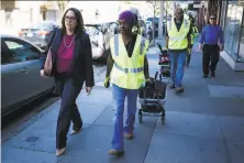  ?? Mason Trinca / Special to The Chronicle 2017 ?? Director Sandra Zuniga (left) leads FixIt Team members in 2017. Zuniga has pleaded guilty in the FBI probe of City Hall.