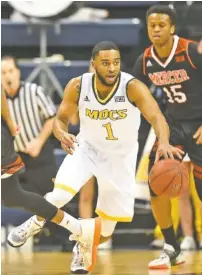  ?? STAFF PHOTO BY ROBIN RUDD ?? UTC senior Greg Pryor dribbles through traffic during Saturday’s 64-54 loss to Mercer. The Mocs close the regular season tonight at The Citadel, and the SoCon tournament starts Saturday in Asheville, N.C.