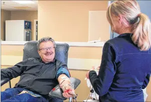  ?? EMILY ACORN/THE GUARDIAN ?? Nurse Sheila McKillop shares a laugh with Larry Sider as he donates plasma at the Charlottet­own clinic for Canadian Blood Services, located at 85 Fitzroy St.