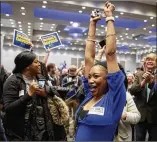  ?? WHITNEY CURTIS / GETTY IMAGES ?? Backers of Democrat Sharice Davids in Kansas’ 3rd Congressio­nal District exult Tuesday at a watch party in Olathe, Kansas. She beat GOP incumbent Kevin Yoder.