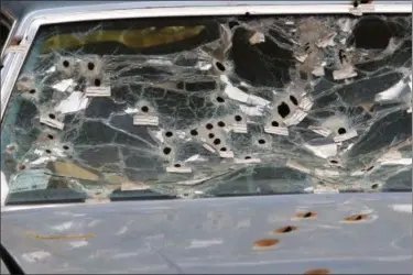  ?? ASSOCIATED PRESS FILE ?? The front windshield of the car driven by Timothy Russell is shown in 2015 in Cleveland. Cleveland police officer Michael Brelo, 31, was tried on two counts of voluntary manslaught­er in the November 2012 deaths of Russell, 43, and Malissa Williams, 30,...