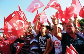  ?? Lefteris Pitarakis / AP ?? Turks were out in force to attend a National Unity March in Istanbul yesterday
