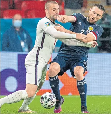  ??  ?? Stephen O’donnell battles for possession with England’s Luke Shaw at Wembley