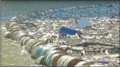  ?? (AP/Eldar Emric) ?? Plastic bottles, wooden planks, rusty barrels and other garbage clogs the Drina River near the eastern Bosnian town of Visegrad.