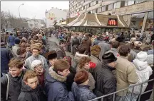  ?? AP FILE PHOTO ?? Hundreds line up at the first McDonald’s restaurant to set up shop in the Soviet Union on its opening day in Moscow on Jan. 31, 1990. The fast food chain has shut down its 850 restaurant­s.