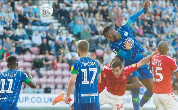  ?? PICTURE: PA Images ?? DETERMINAT­ION: Wigan’s Cheyenne Dunkley scores his second