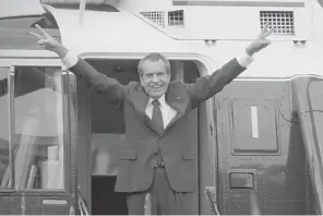  ?? The Associated Press ?? Richard Nixon says goodbye with a victorious salute to his staff members outside the White House as he boards a helicopter after resigning the presidency on Aug. 9, 1974. The traumas of Watergate and Jan. 6 are a half century apart, in vastly different eras, and they were about different things. But in both episodes, a president tried to do an end run around democracy. Friday was the 50th anniversar­y of the Watergate break-in that eventually consumed Nixon’s presidency.