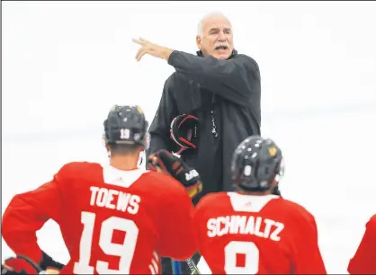  ?? JOSE M. OSORIO/CHICAGO TRIBUNE ?? Blackhawks head coach Joel Quennevill­e talks to the team at the first practice of camp held at MB Ice Arena in Chicago on Sept. 14.