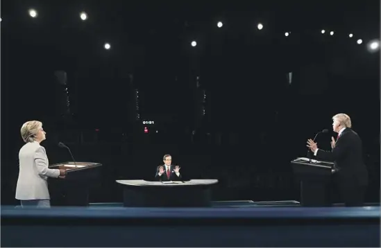  ?? Joe Raedle Pool Photo ?? MODERATOR Chris Wallace challenged the candidates to explain their positions on Supreme Court nominees, immigratio­n and taxes during the debate in Las Vegas.