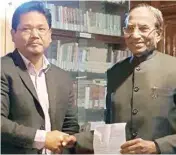  ??  ?? NPP’S Conrad Sangma met Meghalaya governor Ganga Prasad at Raj Bhawan in Shillong on Sunday to stake claim to form the new government in Meghalaya