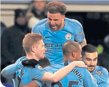  ??  ?? Manchester City players celebrate their side’s second goal at Goodison Park this week