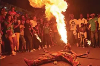  ?? — AFP photos ?? Revelers perform on the first day of the 2018 National Carnival Parade in Port-au-Prince.