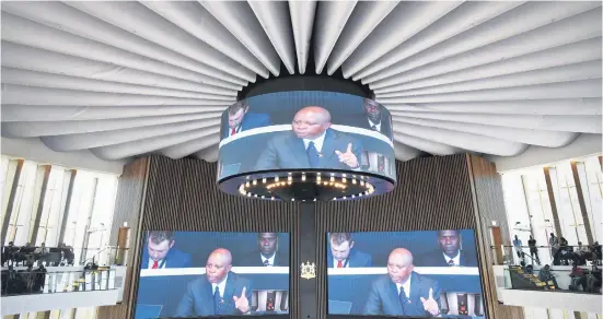  ?? Picture: Refilwe Modise ?? MAN OF THE MOMENT. Joburg mayor Herman Mashaba is pictured on the screens as he delivers his state of the city address in the newly-built council chambers in Braamfonte­in in May. Moves are afoot to institute a motion of no confidence in him today.