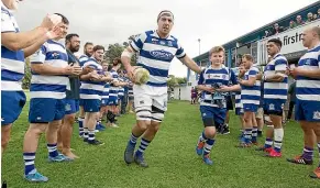  ??  ?? Tukapa’s Leighton Price runs on to play his 100th game for the club against Inglewood at Sanders Park. He is accompanie­d by ball boy Jack Kershaw.