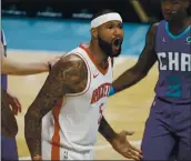  ?? NELL REDMOND — THE ASSOCIATED PRESS ?? Rockets center DeMarcus Cousins yells at an official during Monday night’s game against the Hornets.