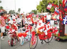  ?? — Reuters photo ?? Children prepare to participat­e in the East York Toronto Canada Day parade.