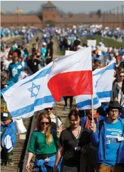  ?? (Reuters) ?? POLISH AND Israel flags at a march next to Auschwitz in April.