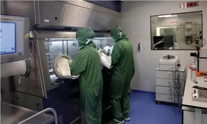  ?? Photograph: Thomas Coex/AFP/Getty ?? Lab technician­s in France work on a machine to produce Car T cells, which researcher­s in Chinabelie­ve could help shrink tumours in the digestive system.