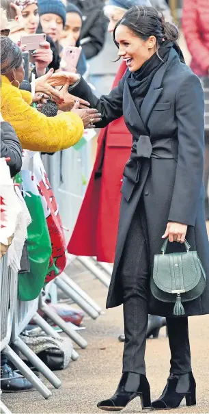  ??  ?? Meghan Markle charmed crowds yesterday sporting clothes designed in Wales