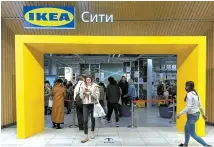  ?? Reuters-Yonhap Reuters-Yonhap ?? Customers walk in IKEA store, in Moscow, March 3.