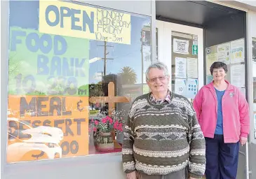  ??  ?? Welcoming locals back to The Crossing Drop-In Centre in Drouin are committee member Alan Lamond and centre coordinato­r Pauline Ward.