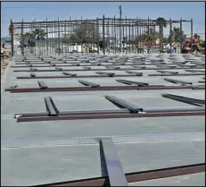  ?? PHOTO BY RANDY HOEFT/YUMA SUN ?? METAL BEAMS ARE SPREAD out across one of the concrete foundation­s of the Yuma-Mesa Storage facility under constructi­on in the 2700 block of East Palo Verde Street.