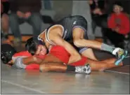  ?? BARRY TAGLIEBER — FOR DIGITAL FIRST MEDIA ?? Phoenixvil­le’s Antonio Valenteen controls Owen J. Roberts’ Joshua Jackson during their bout at 106 Wednesday.