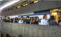  ??  ?? Courtesy photo Students from Golden Valley High School, dressed in their finest, board a Metrolink train en route to their prom. School officials say riding the train to the dance is a reliable and more fiscally responsibl­e mode of transporta­tion.